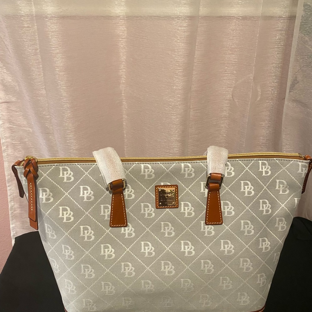 Dooney and Burke large brand new bag with tags. Ash color with key fob.